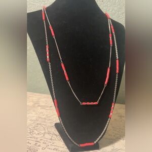 Native American Navajo-style necklace features tube-shaped red coral beads
